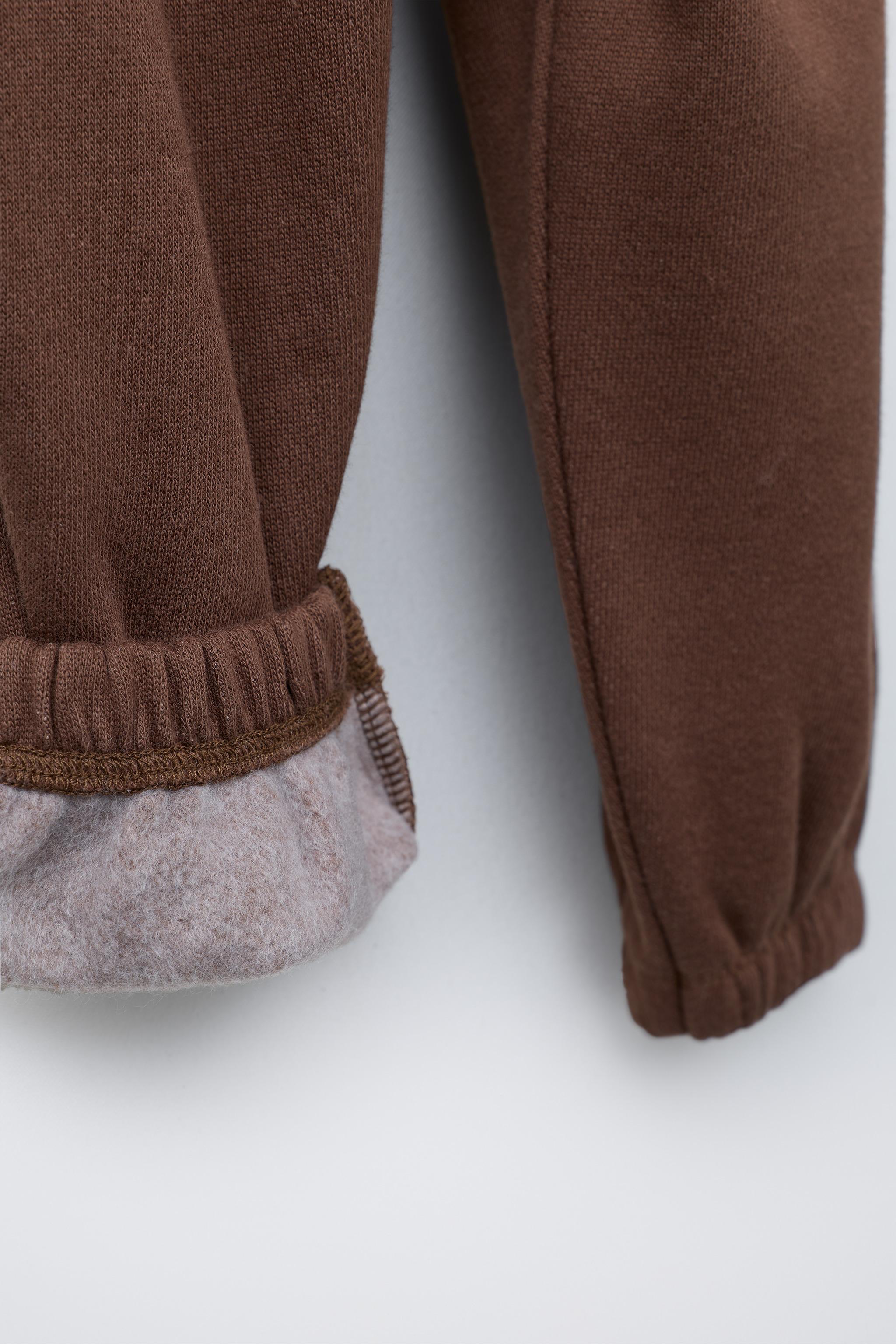 FLOCKED TEXT JOGGER PANTS